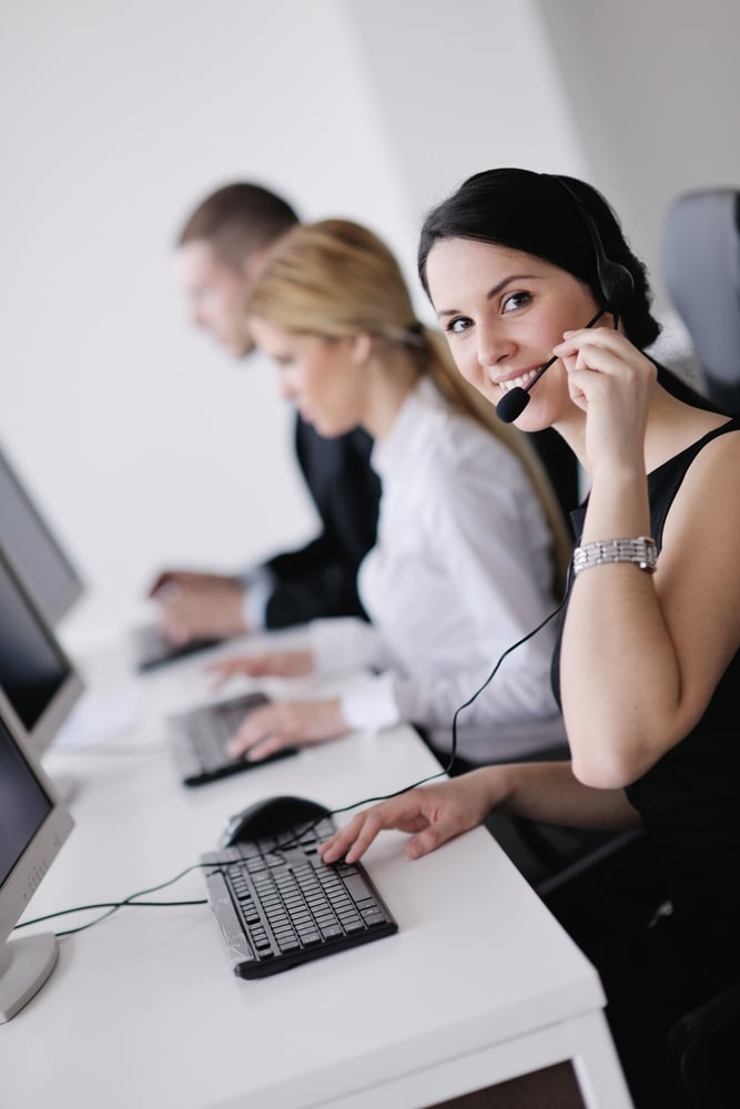 business people group with  headphones giving support in  help desk office to customers, manager giving training and education instructions